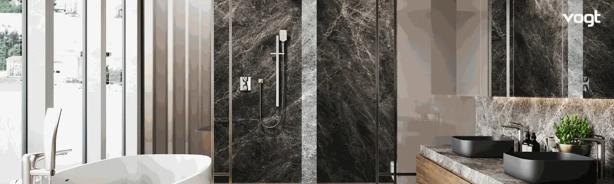 A stylish bathroom featuring a marble wall and a sleek black and white sink, showcasing modern design elements.